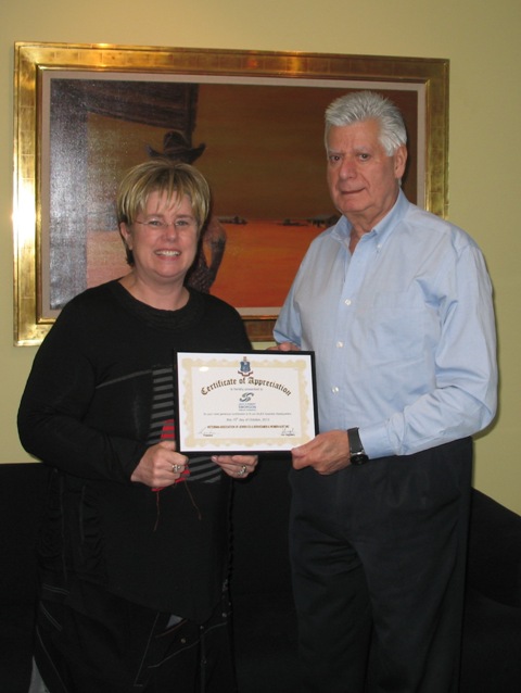 Judy Landau presents Jack Morgan with Certificate of Appreciation from VAJEX